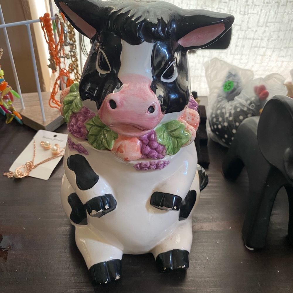 Charming Cow Figurine with Floral Accents cookie jar